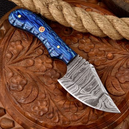 A handmade 6-inch Damascus steel skinner knife with a blue wood handle