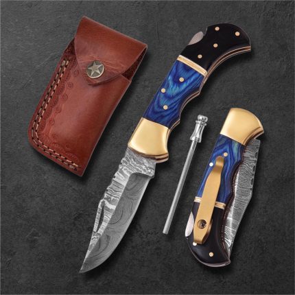 6.5″ handmade Damascus steel pocket knife with pocket clip and leather sheath.