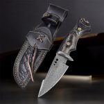 10″ handmade Damascus steel hunting knife with black wood handle and leather sheath.