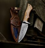 10″ Damascus steel hunting knife with olive wood handle and leather sheath.
