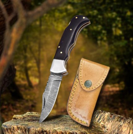 BCK Damascus steel fixed blade pocket knife with leather sheath.