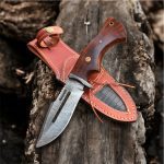 BCK Damascus steel tactical hunting knife with rose wood handle and leather sheath.