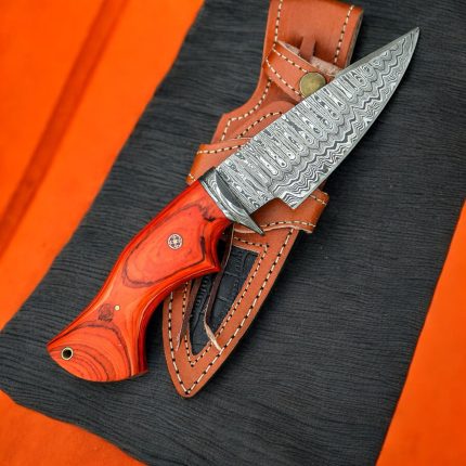 10-inch BCK handmade Damascus steel hunting knife with an orange wood handle and leather sheath